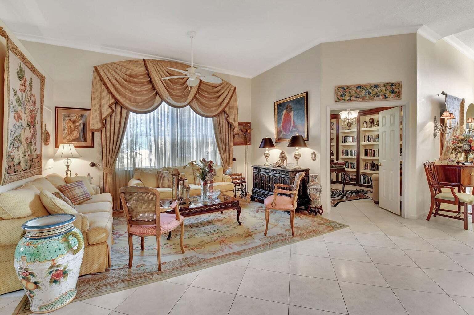 7035 Vivaldi Lane Delray Beach, FL 33446 - Photo 13 of 39 a living room with furniture and a floor to ceiling window