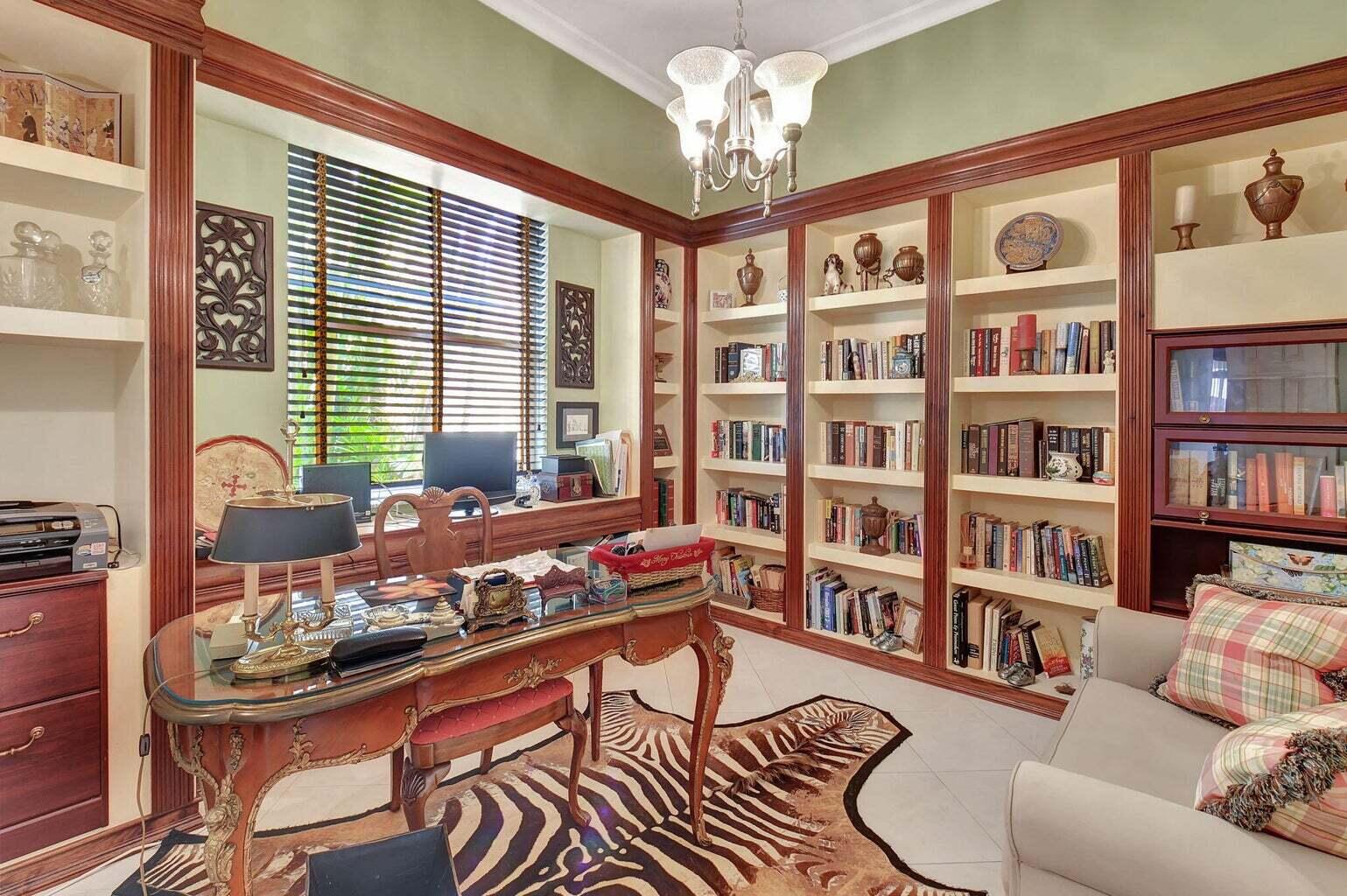 7035 Vivaldi Lane Delray Beach, FL 33446 - Photo 14 of 39 a living room with furniture a bookshelf and a window