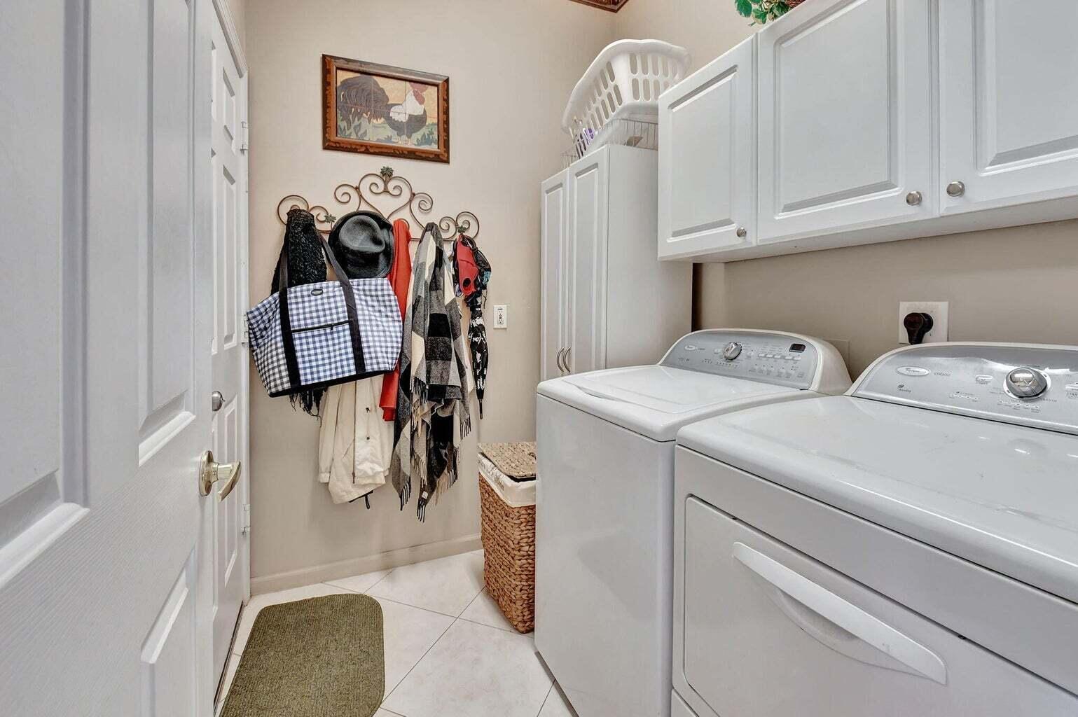 7035 Vivaldi Lane Delray Beach, FL 33446 - Photo 20 of 39 a utility room with dryer and washer