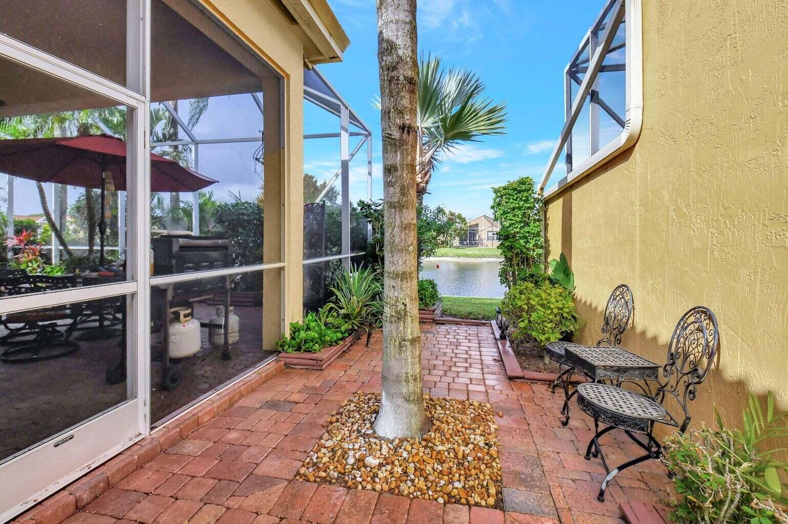 7035 Vivaldi Lane Delray Beach, FL 33446 - Photo 24 of 39 a garden view with a seating space