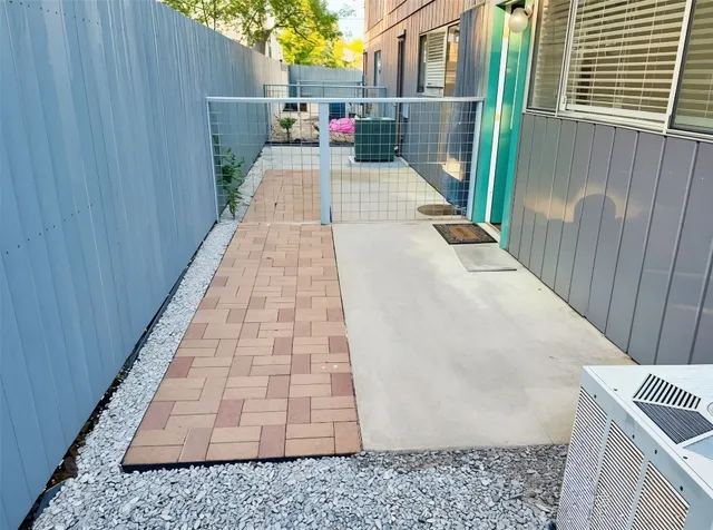a view of backyard with outdoor seating and green space