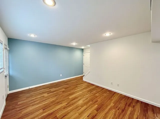 a view of room with wooden floor