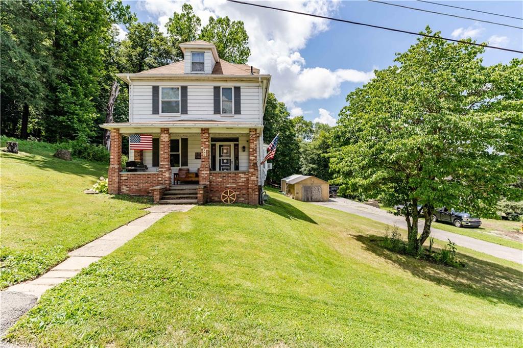 402 Walnut Street Point Marion, PA 15474 - Photo 1 of 19 a view of a house with swimming pool and sitting area