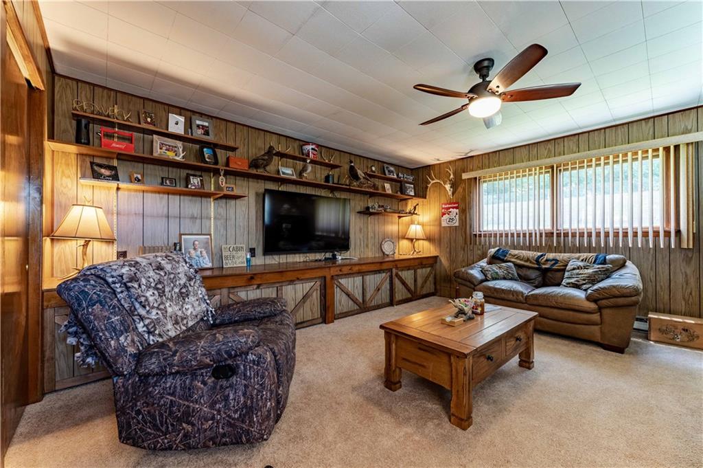 402 Walnut Street Point Marion, PA 15474 - Photo 11 of 19 a living room with furniture and a flat screen tv