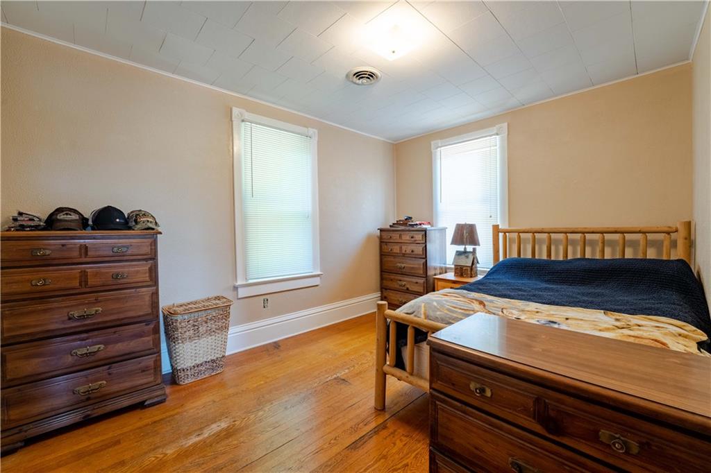402 Walnut Street Point Marion, PA 15474 - Photo 14 of 19 a view of a room with wooden floor and chair