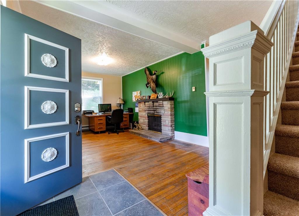 402 Walnut Street Point Marion, PA 15474 - Photo 3 of 19 a living room with furniture and a fireplace