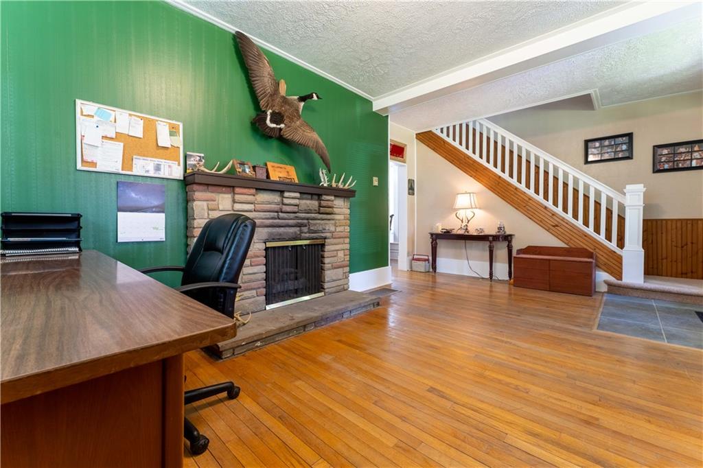 402 Walnut Street Point Marion, PA 15474 - Photo 5 of 19 a living room with furniture and a fireplace
