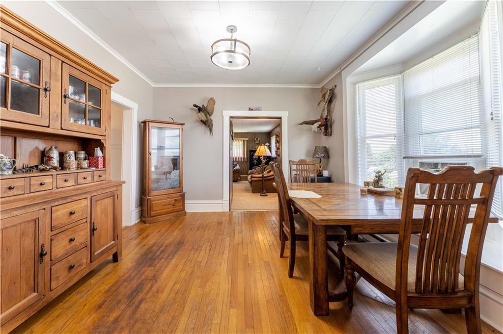 402 Walnut Street Point Marion, PA 15474 - Photo 6 of 19 a view of a dining room with furniture window and wooden floor
