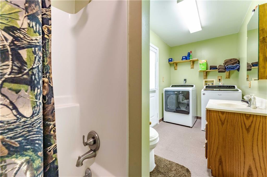 402 Walnut Street Point Marion, PA 15474 - Photo 10 of 19 a bathroom with a sink a washer and dryer
