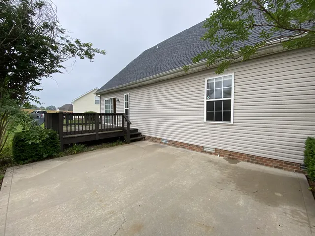 a view of house with outdoor space and porch