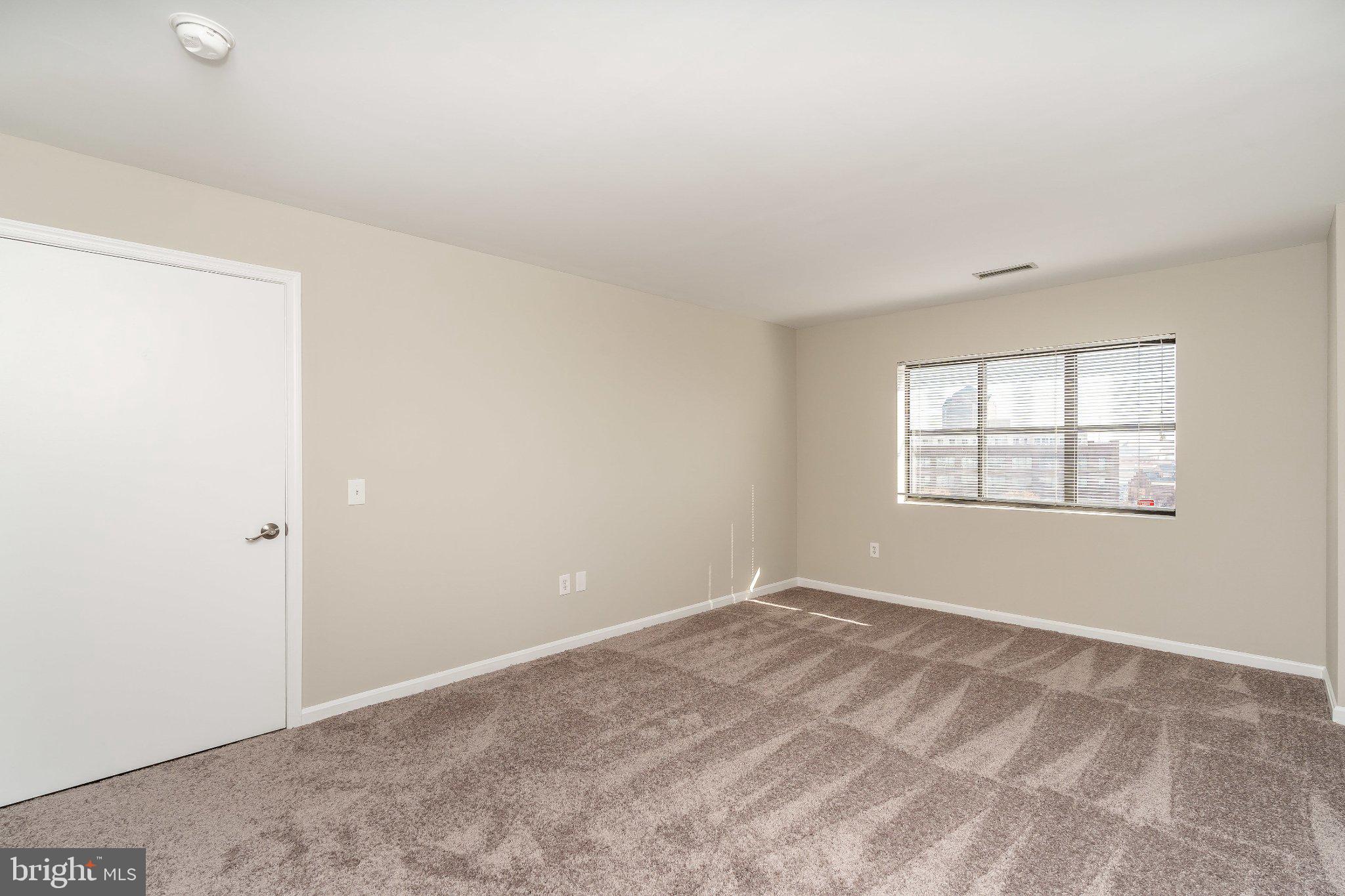 2702 Lighthouse Point East, Unit 532 Baltimore, MD 21224 - Photo 25 of 41 Spacious room with natural light.