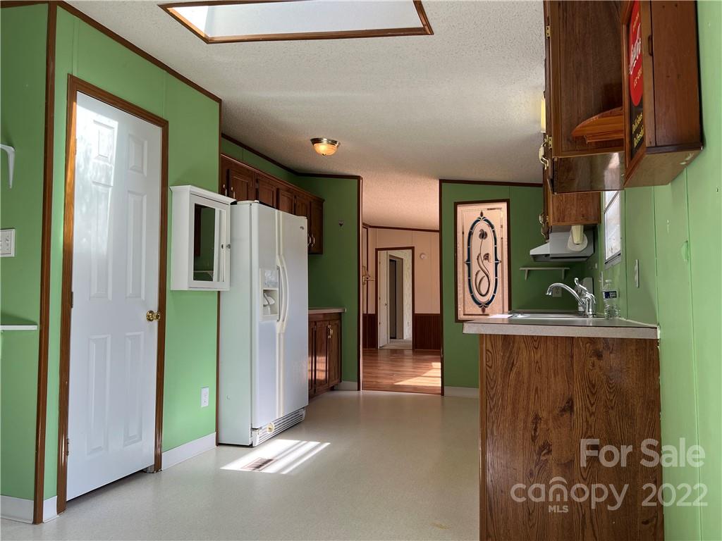 8581 Highway 268 Elkin, NC 28621 - Photo 14 of 45 a view of a hallway with entryway and furniture