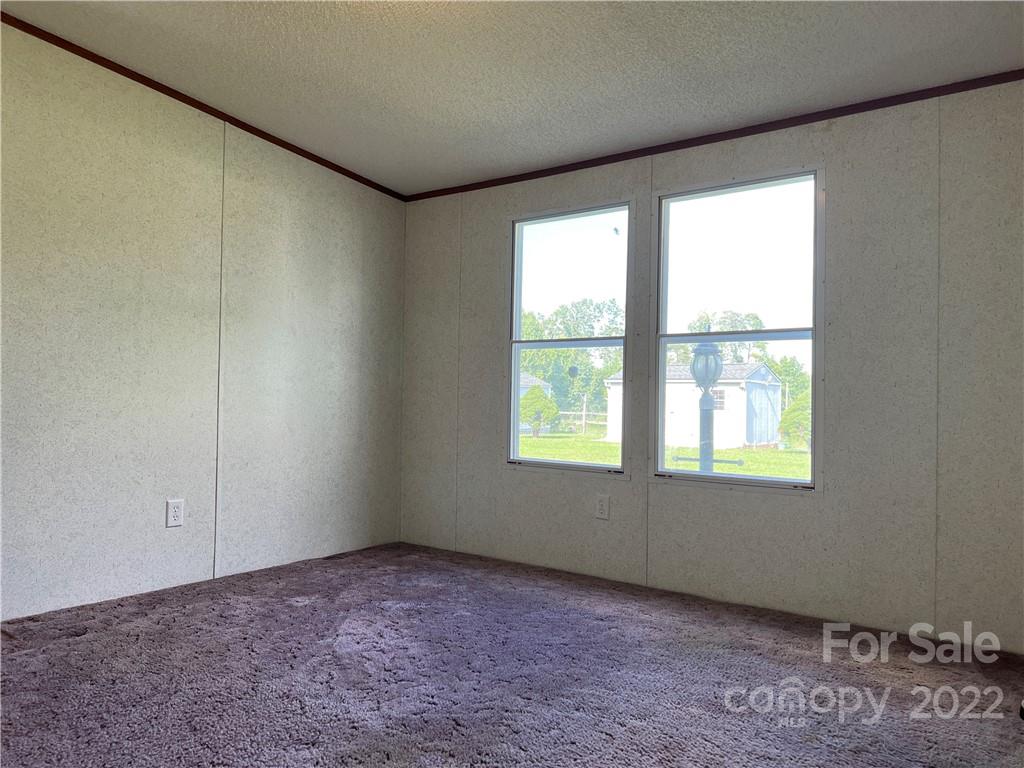 8581 Highway 268 Elkin, NC 28621 - Photo 24 of 45 an empty room with a window