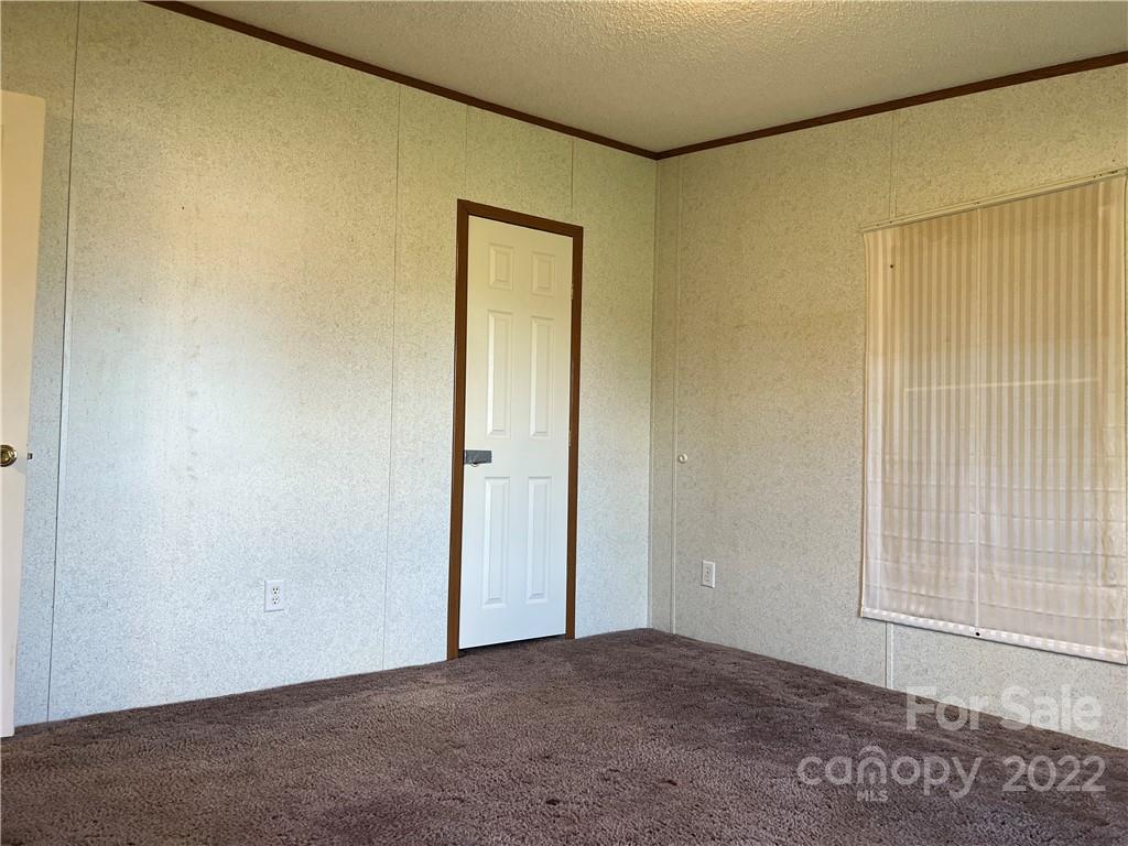 8581 Highway 268 Elkin, NC 28621 - Photo 31 of 45 an empty room with windows