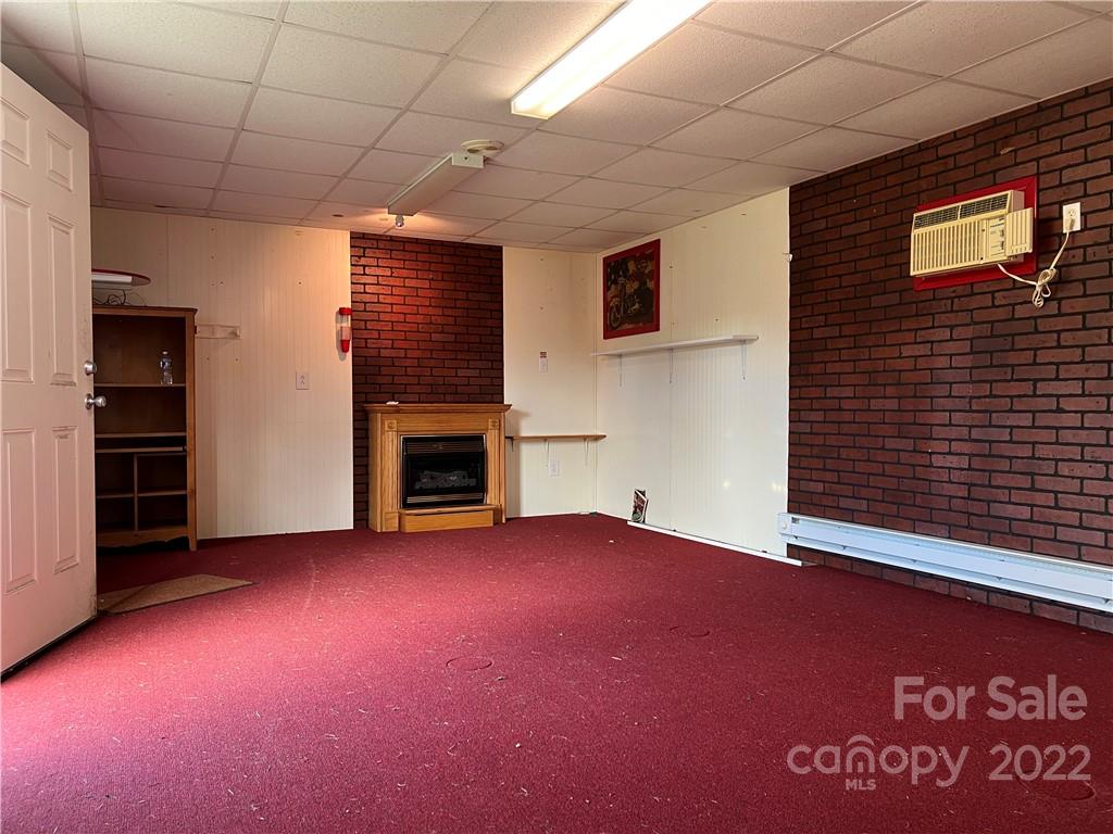 8581 Highway 268 Elkin, NC 28621 - Photo 40 of 45 a view of empty room with a fireplace