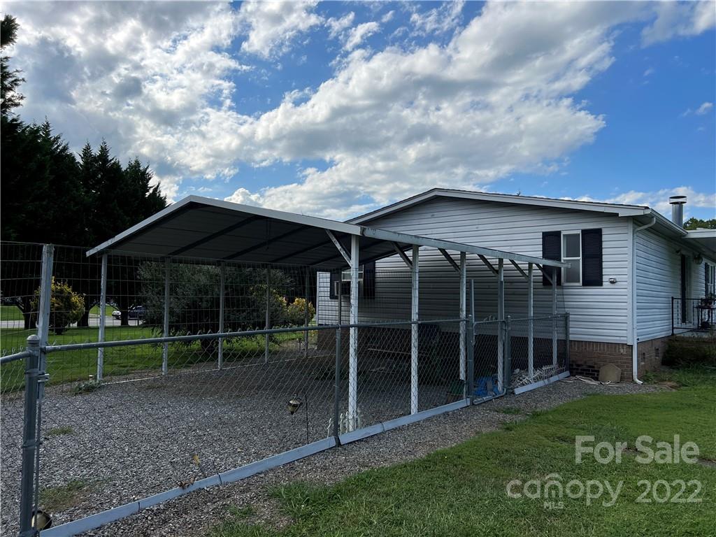 8581 Highway 268 Elkin, NC 28621 - Photo 43 of 45 a view of a house with a yard and a garden