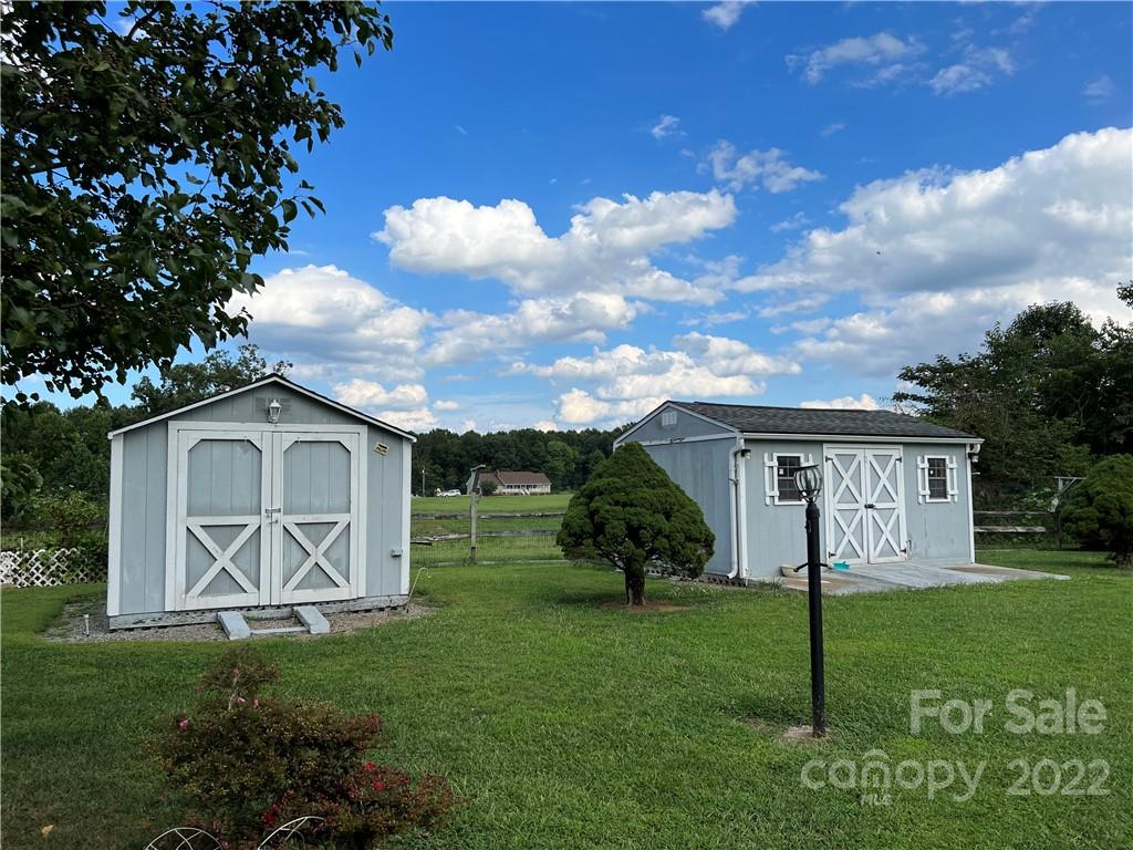8581 Highway 268 Elkin, NC 28621 - Photo 5 of 45 a view of a house with backyard and a garden