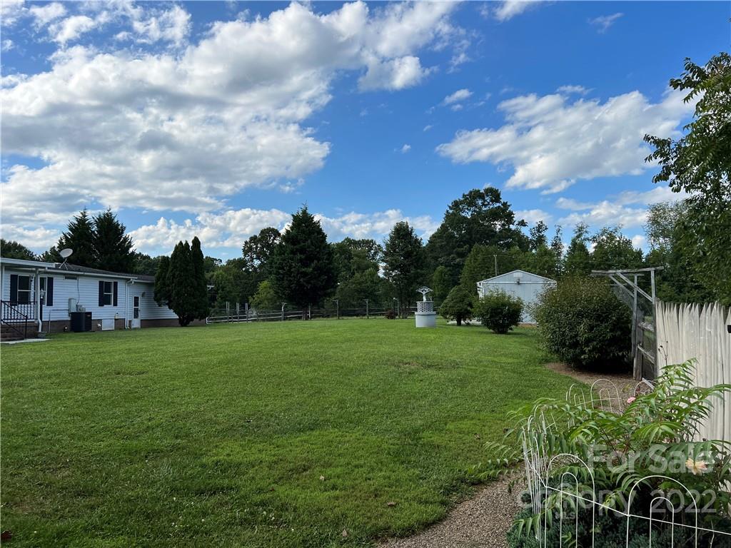 8581 Highway 268 Elkin, NC 28621 - Photo 6 of 45 a view of a big yard with a house