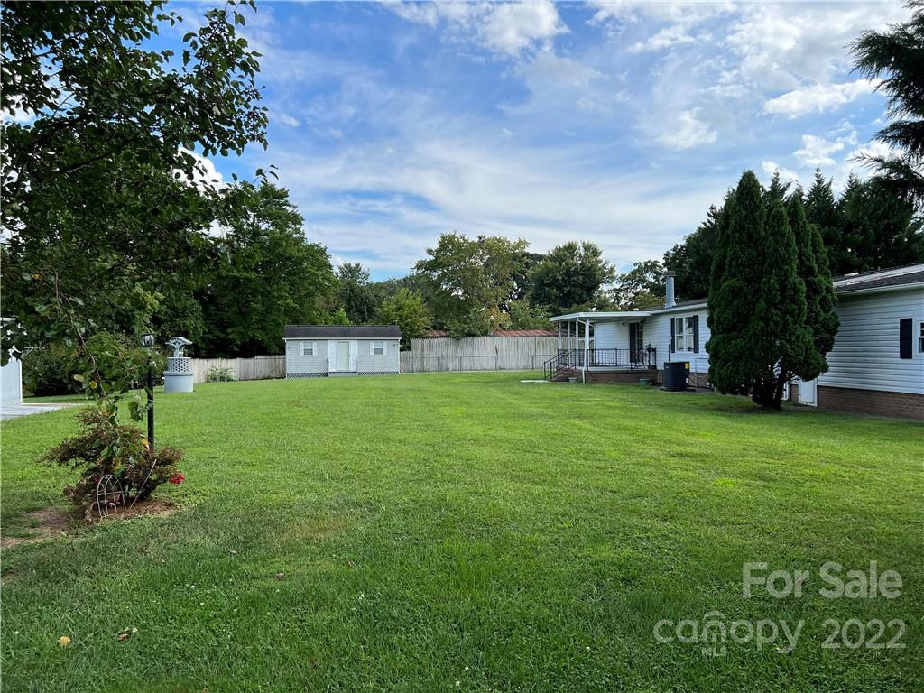 8581 Highway 268 Elkin, NC 28621 - Photo 7 of 45 a view of a house with a backyard