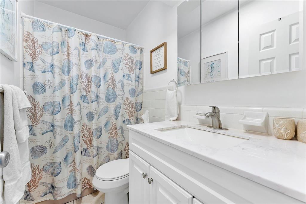 555 North Riverside Drive, Unit 25 Pompano Beach, FL 33062 - Photo 12 of 24 a bathroom with a sink and a toilet