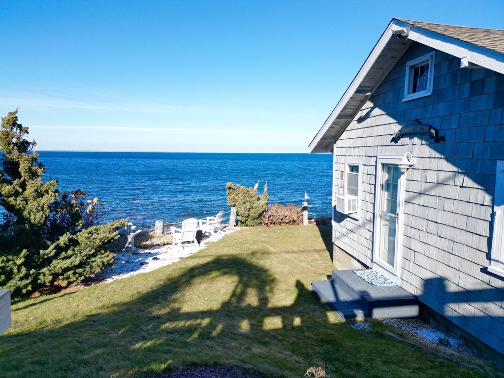 232 Manomet Point Road Plymouth, MA 02360 - Photo 22 of 24 a aerial view of a house with a yard