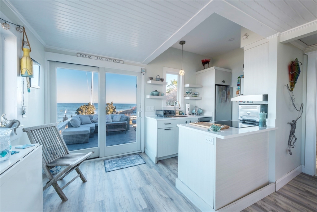 232 Manomet Point Road Plymouth, MA 02360 - Photo 6 of 24 a living room with furniture and a wooden floor