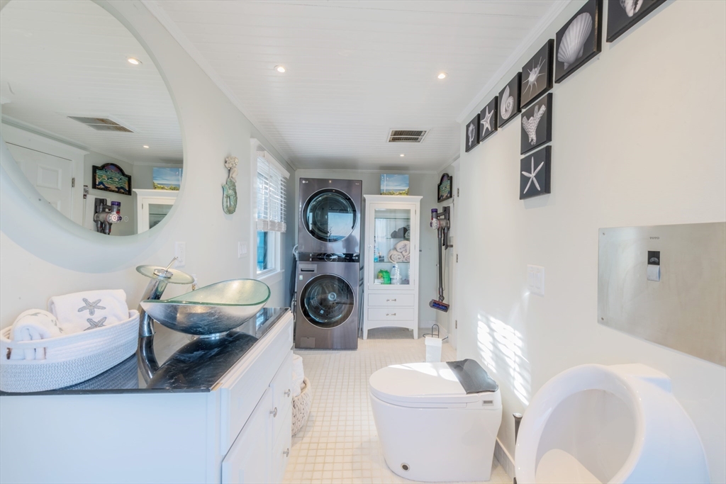 232 Manomet Point Road Plymouth, MA 02360 - Photo 8 of 24 a living room with furniture and a wooden floor