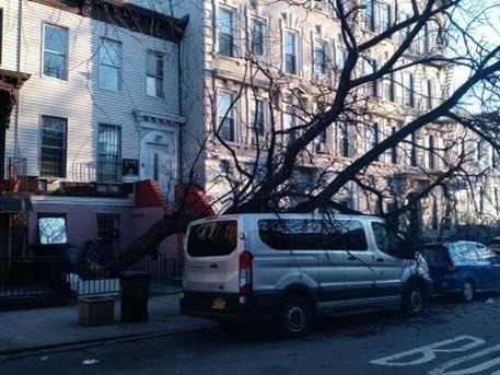 a view of a house with a car parked in front of it