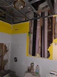 689 Madison Street Brooklyn, NY 11221 - Photo 13 of 20 a bathroom with a sink and a mirror