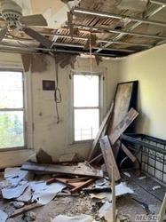 689 Madison Street Brooklyn, NY 11221 - Photo 3 of 20 a living room with a couch and a window