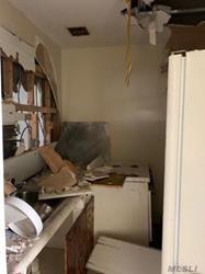 689 Madison Street Brooklyn, NY 11221 - Photo 5 of 20 a kitchen with a stove and a refrigerator