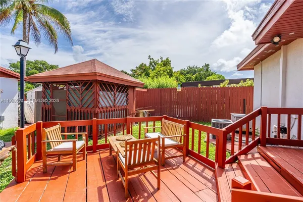 a view of an outdoor sitting area with swimming pool