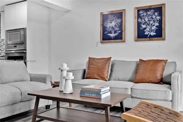 a living room with furniture and a table