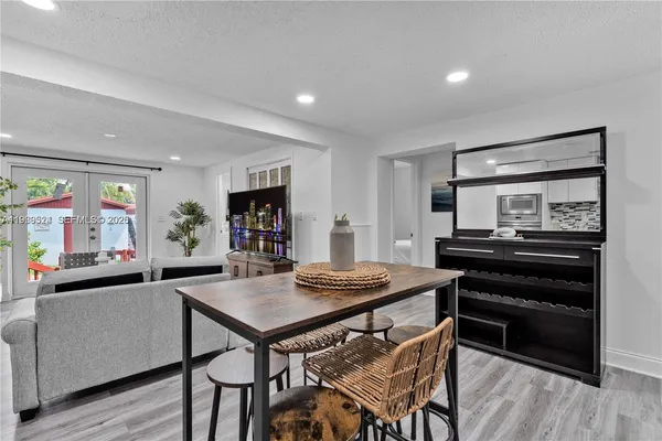 a kitchen with a table and chairs in it