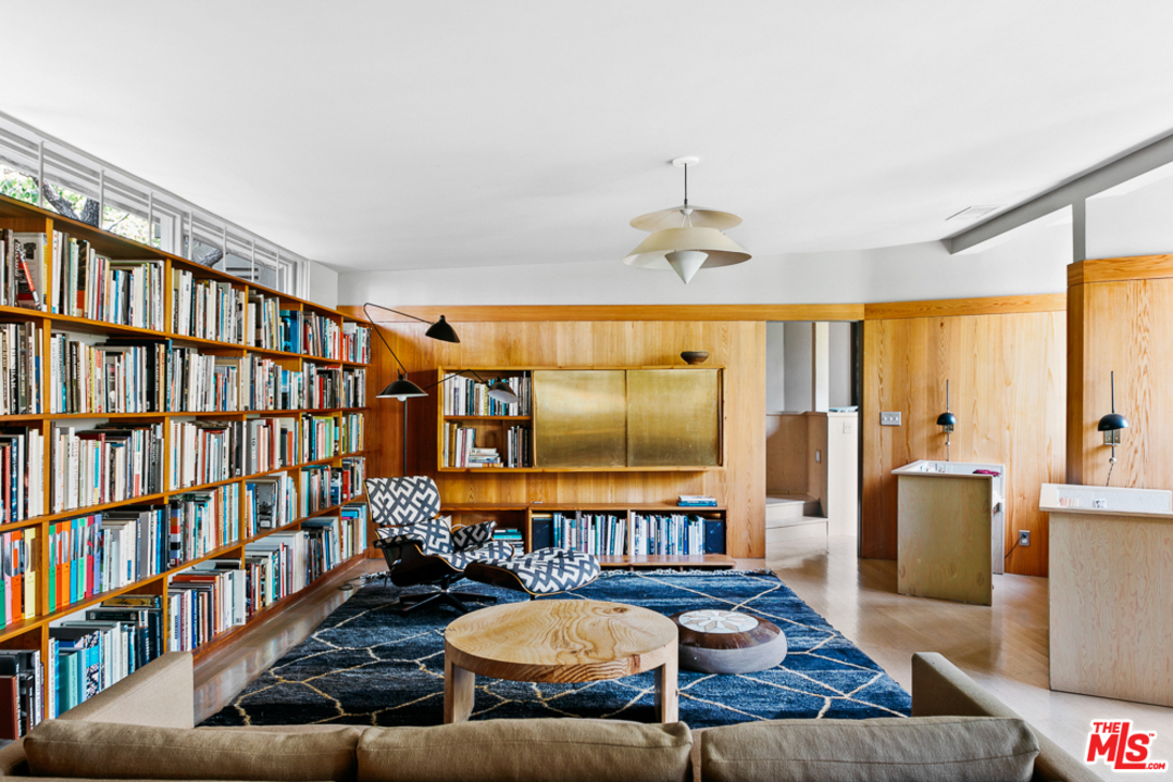 11600 Amanda Drive Studio City, CA 91604 - Photo 12 of 33 a living room with furniture fireplace and book shelf