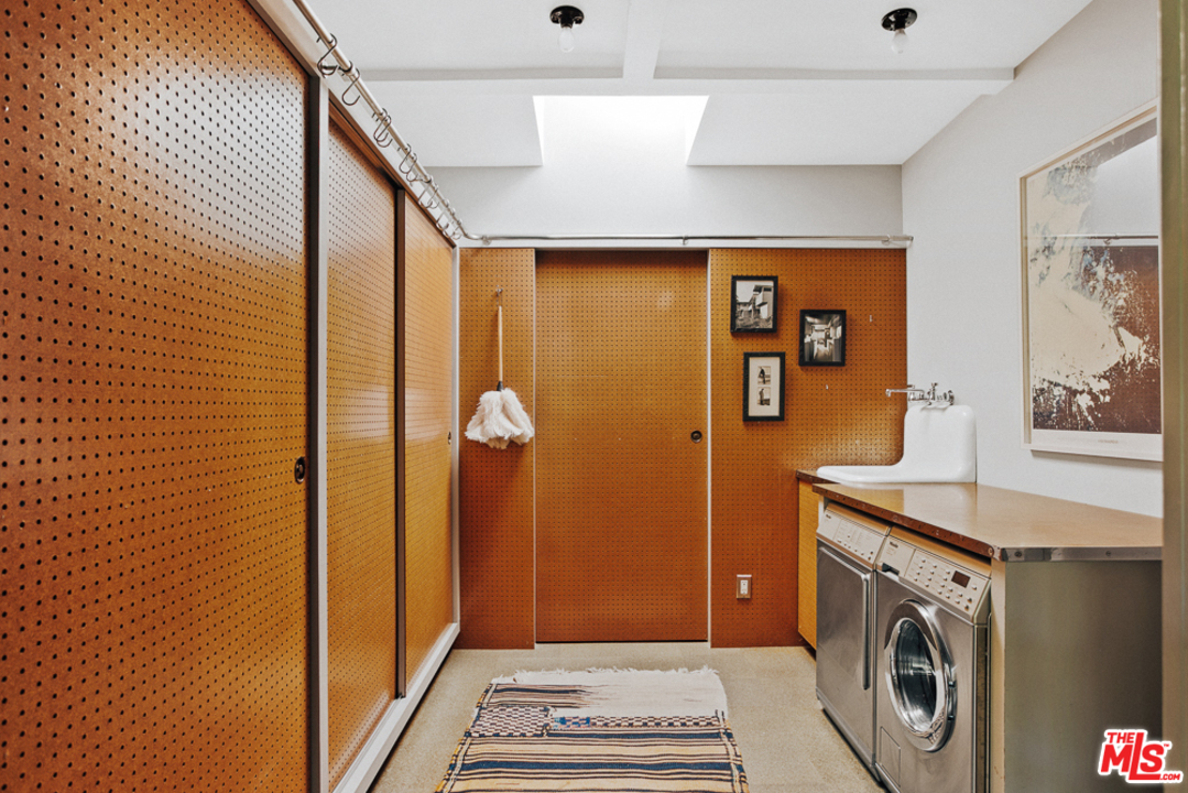 11600 Amanda Drive Studio City, CA 91604 - Photo 13 of 33 a bathroom with a sink a mirror and a shower