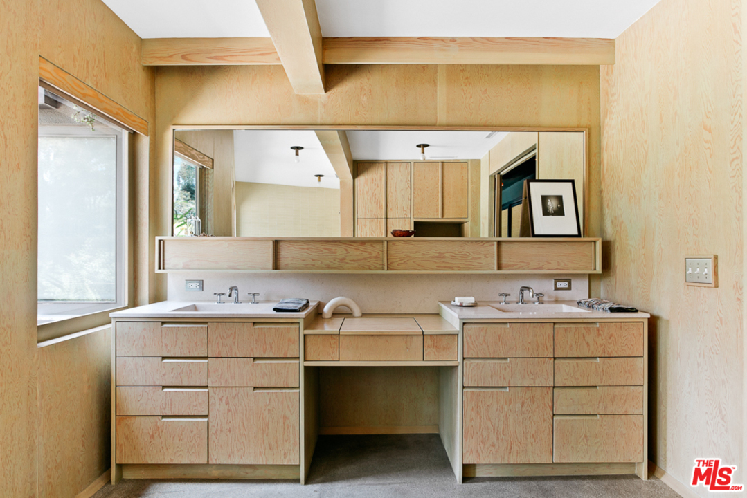 11600 Amanda Drive Studio City, CA 91604 - Photo 16 of 33 a bathroom with a sink and a mirror