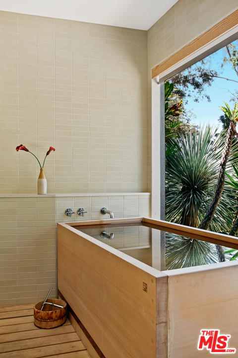 11600 Amanda Drive Studio City, CA 91604 - Photo 17 of 33 a bathroom with a bathtub and a shower
