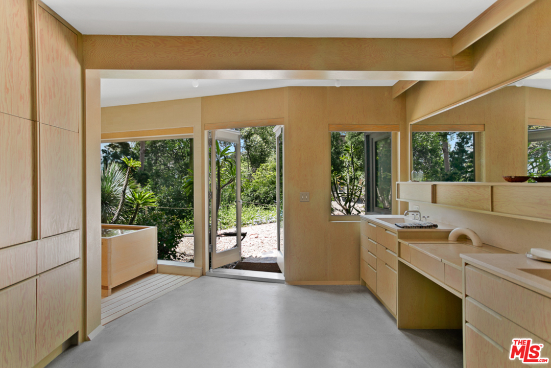 11600 Amanda Drive Studio City, CA 91604 - Photo 19 of 33 a view of a kitchen with a sink and dishwasher with wooden floor