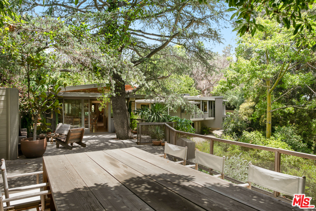 11600 Amanda Drive Studio City, CA 91604 - Photo 25 of 33 a view of a building with sitting area and furniture