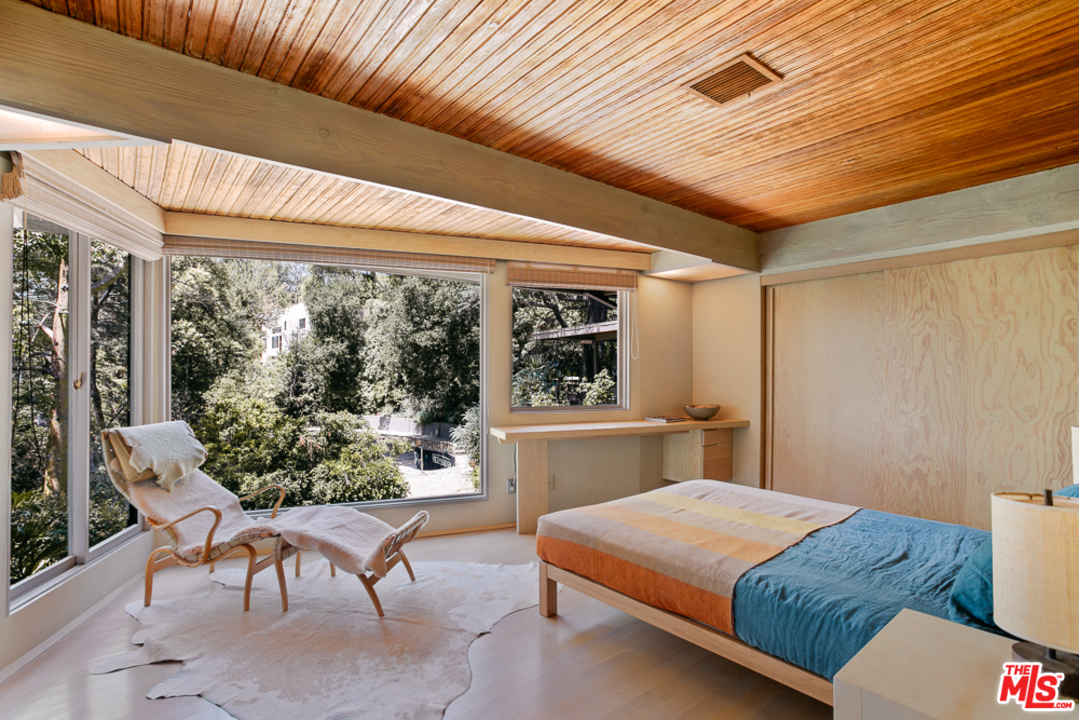 11600 Amanda Drive Studio City, CA 91604 - Photo 9 of 33 a bedroom with a bed and a window