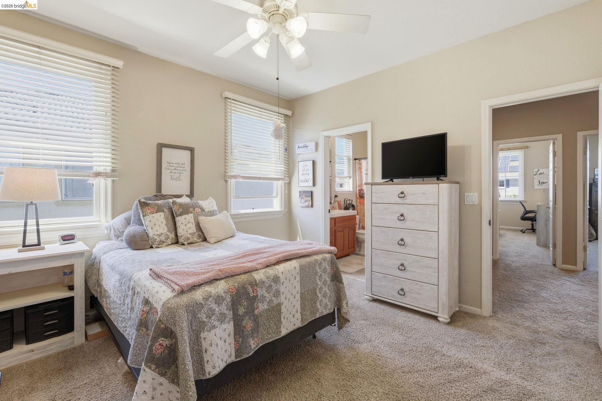 3438 Keystone Loop Discovery Bay, CA 94505 - Photo 32 of 57 a bedroom with a bed and a flat screen tv