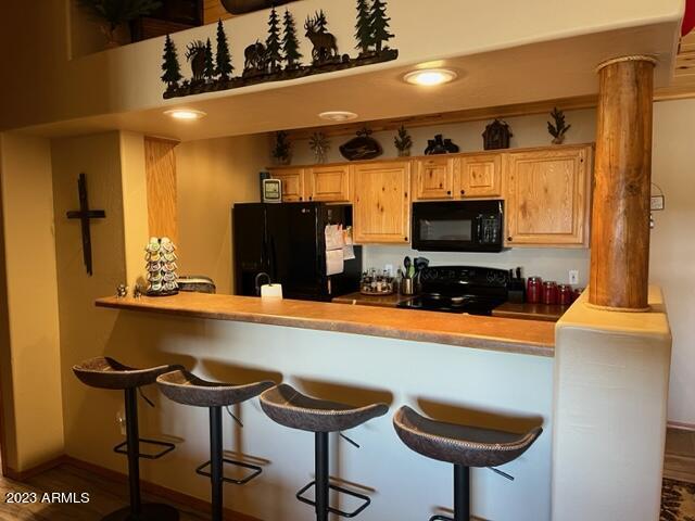 2670 Lodge Loop Overgaard, AZ 85933 - Photo 2 of 20 Bar and open kitchen