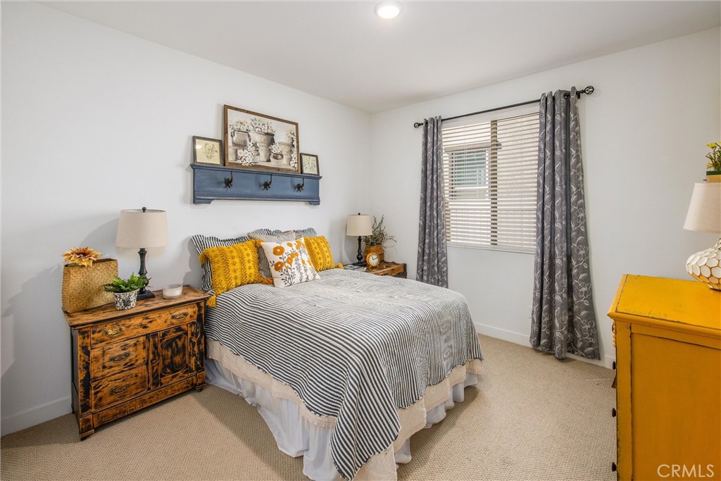 5806 Dragonfly Street Banning, CA 92220 - Photo 11 of 40 a bedroom with a bed and wooden floor