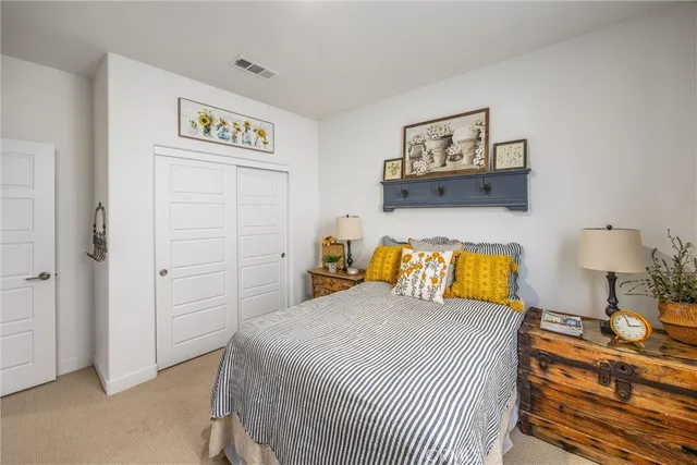 a bathroom with a toilet sink vanity and mirror