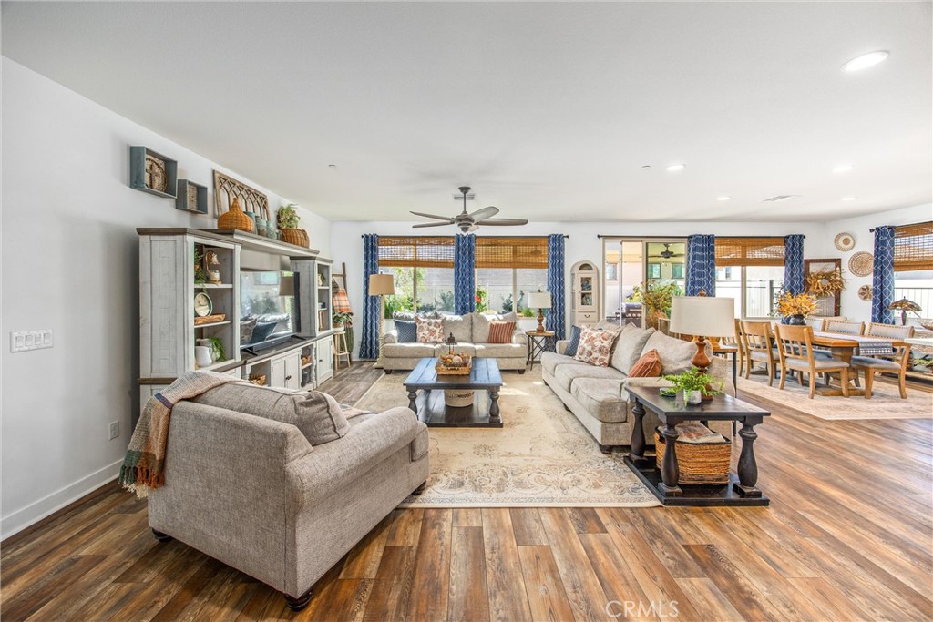 5806 Dragonfly Street Banning, CA 92220 - Photo 16 of 40 a living room with furniture and a wooden floor