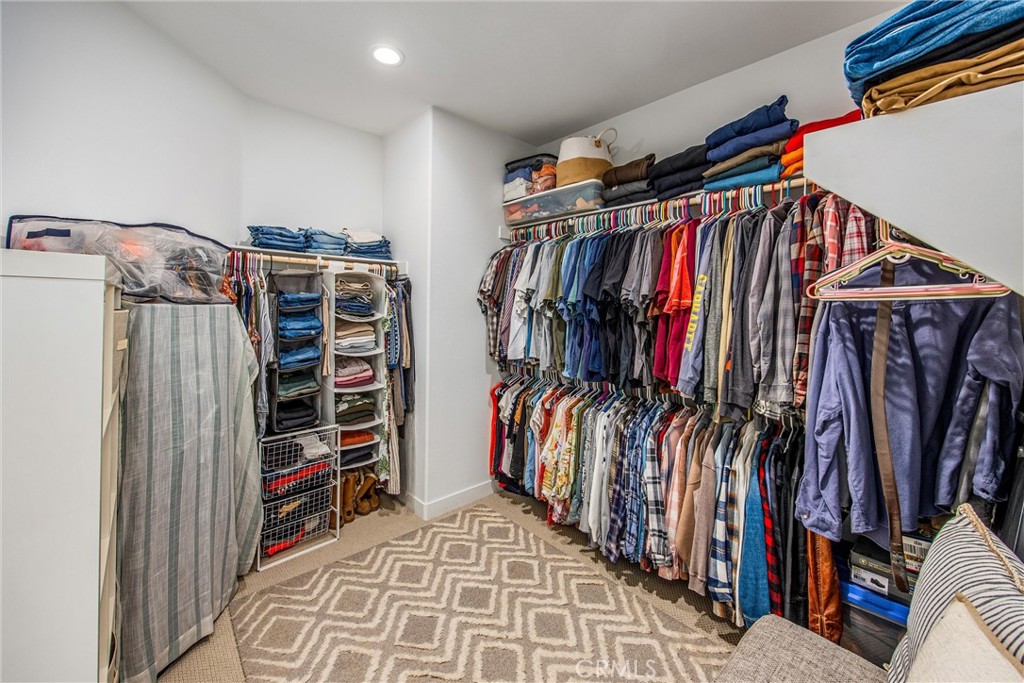 5806 Dragonfly Street Banning, CA 92220 - Photo 33 of 40 a view of walk in closet with clothes and shoes