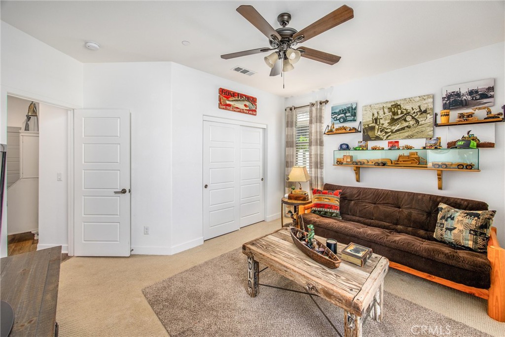 5806 Dragonfly Street Banning, CA 92220 - Photo 8 of 40 a living room with furniture and a ceiling fan