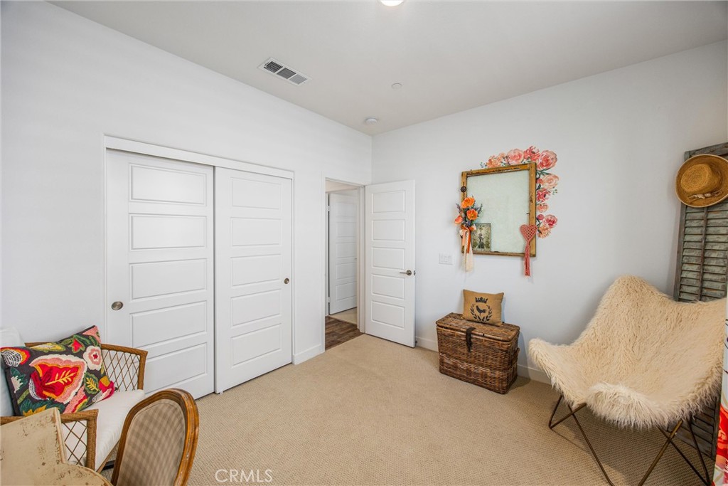 5806 Dragonfly Street Banning, CA 92220 - Photo 10 of 40 a bedroom with a bed and a couch