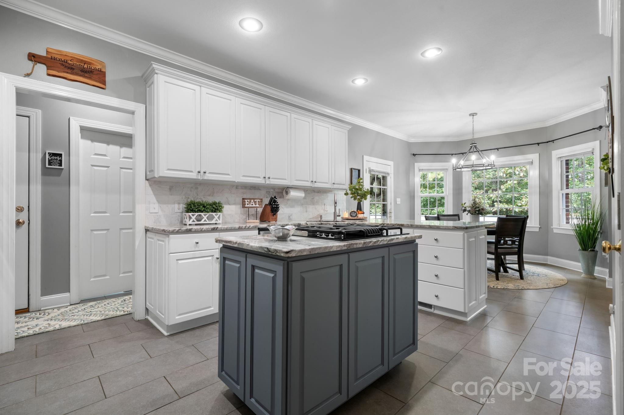 104 Blackhawk Ridge Court Granite Falls, NC 28630 - Photo 11 of 48 a kitchen with granite countertop cabinets stainless steel appliances a sink and a window